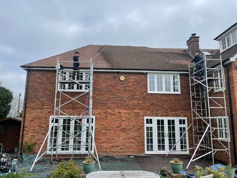 Roof cleaning carried out safely from scaffold towers by The Roof Moss Cleaners in Ampthill